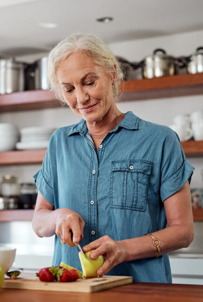 get your fill of wellness with a healthy breakfast. a mature woman preparing a healthy breakfast in the kitchen at home.
